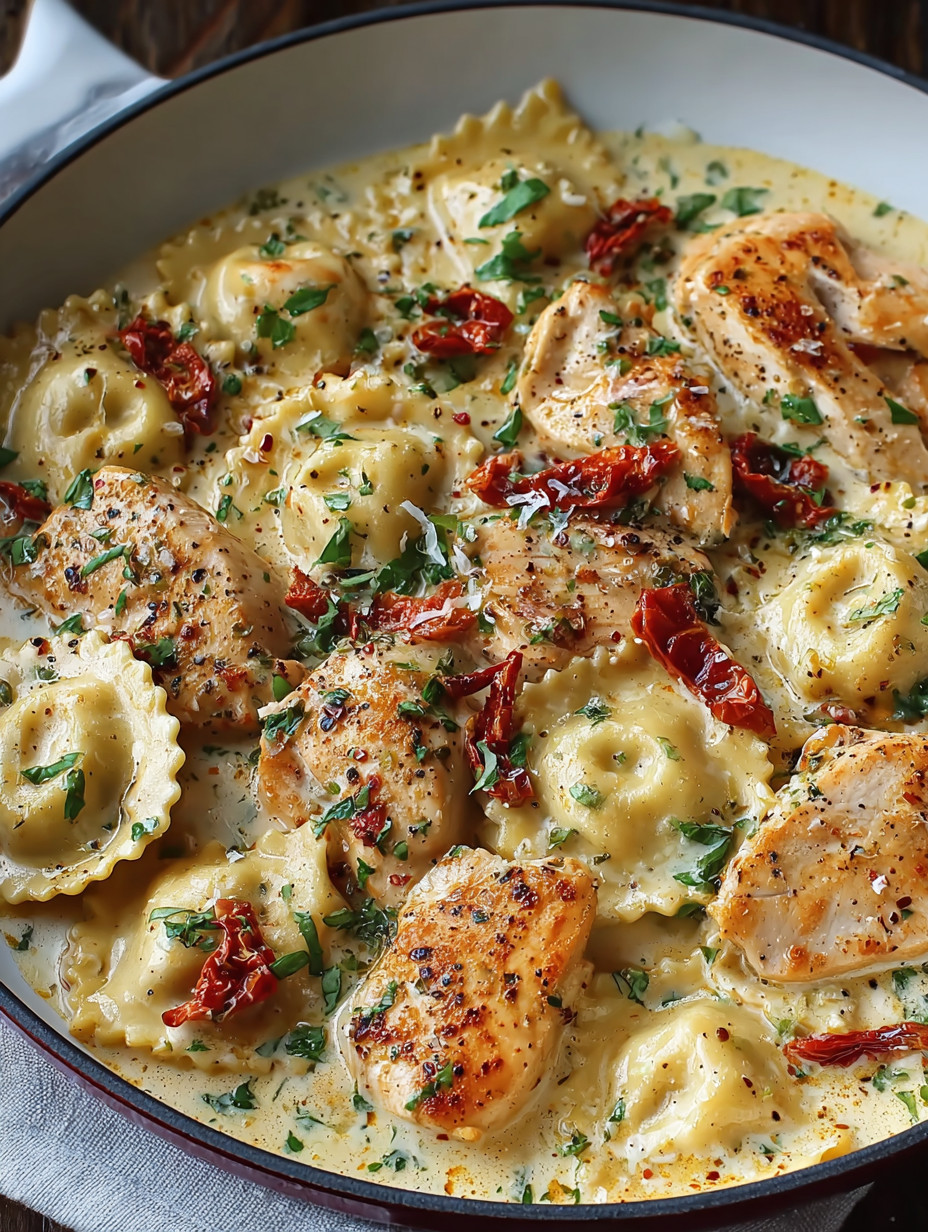 A bowl of pasta with chicken and red peppers.