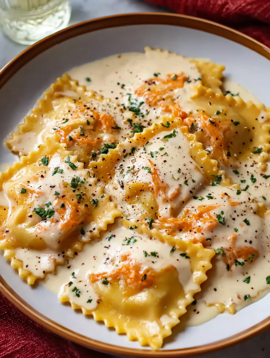 A plate of pasta with sauce.