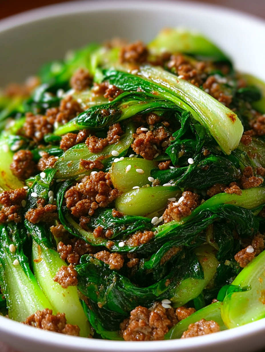 A plate of food with meat and greens.
