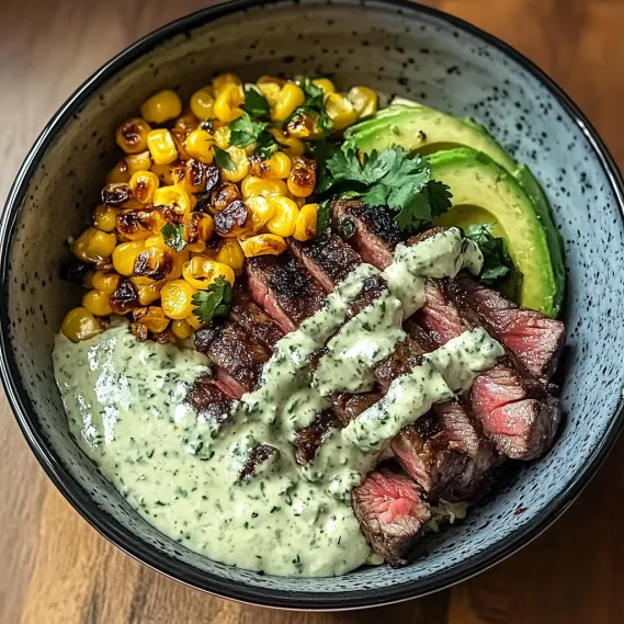 A bowl of food with meat and vegetables.