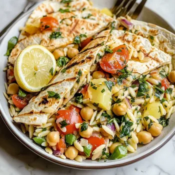 A bowl of food with a fork and a lemon.