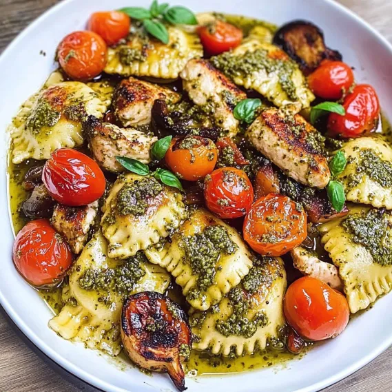 A bowl of food with tomatoes, chicken, and basil.