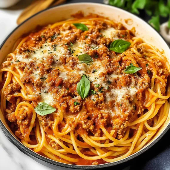A bowl of spaghetti with meat sauce.