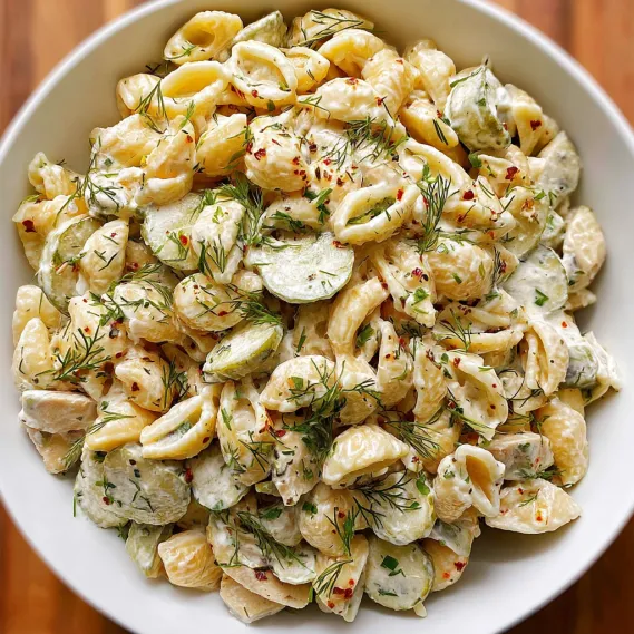 A bowl of pasta with vegetables.