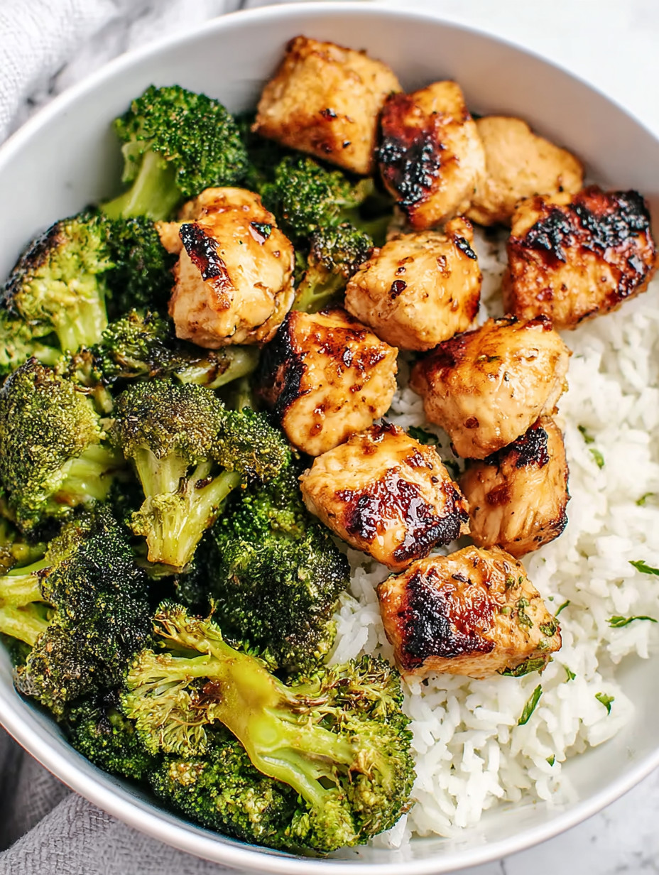 A bowl of rice and broccoli.